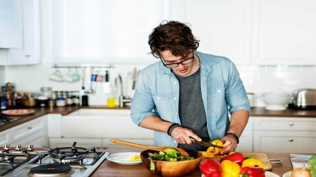 A man cooking by himself