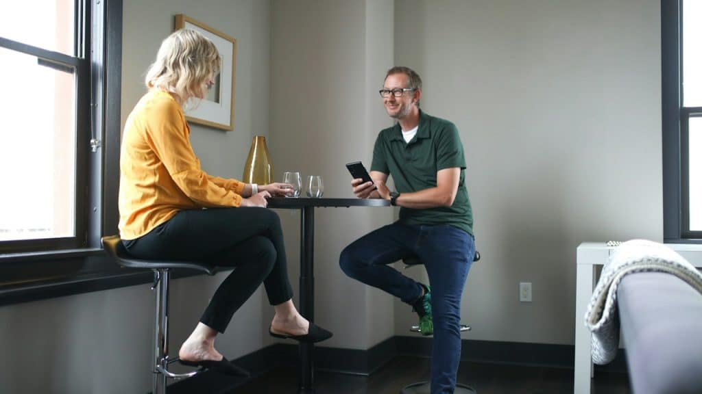 A man and woman having a conversation.
