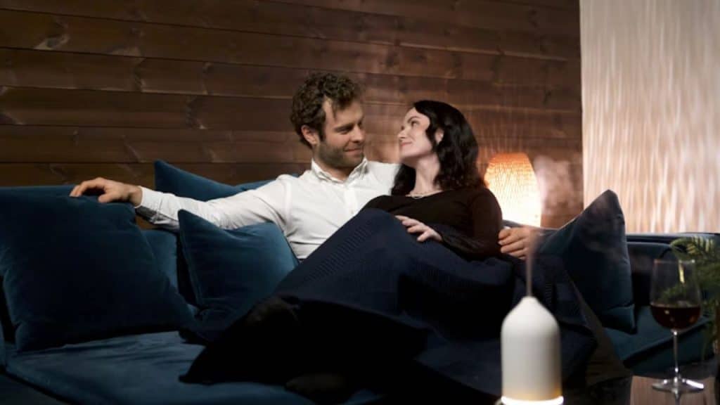 Couple talking calmly on the couch