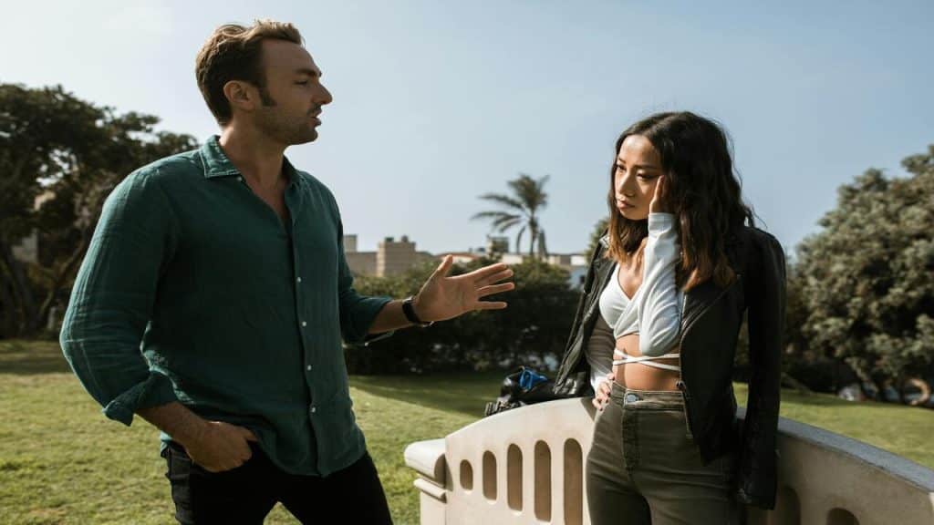 A couple arguing outdoors