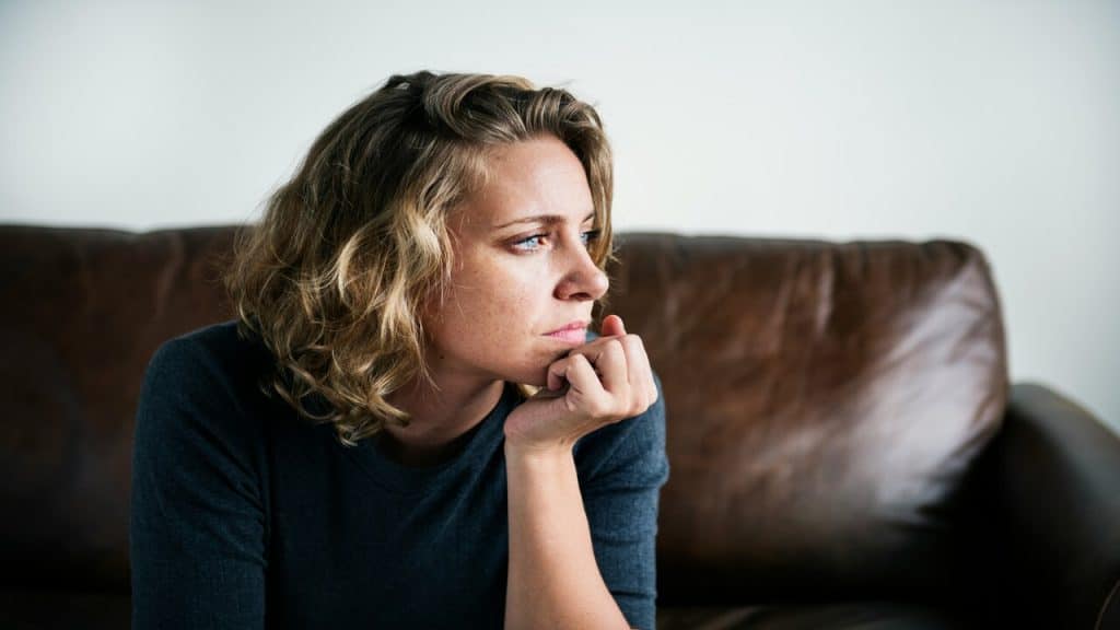 A woman thinking at home