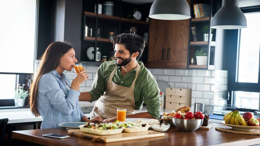 A couple cooking together 