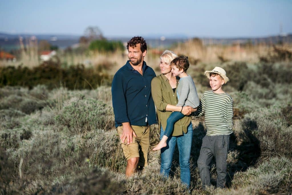The young family is spending time outdoors in Greece.