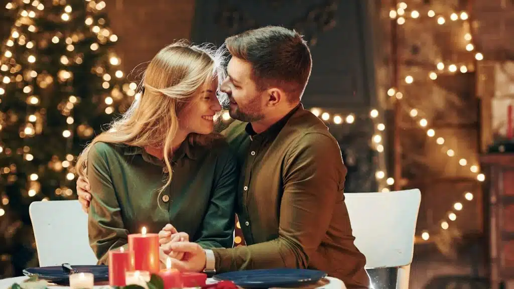 A couple having a romantic candlelight dinner.