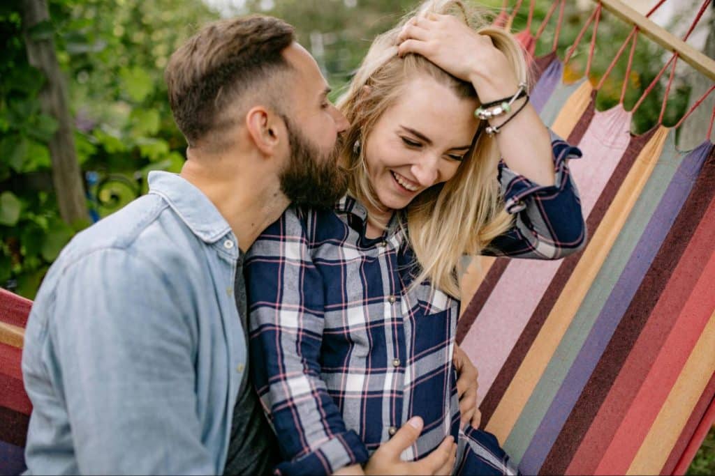 A man kissing a woman’s face