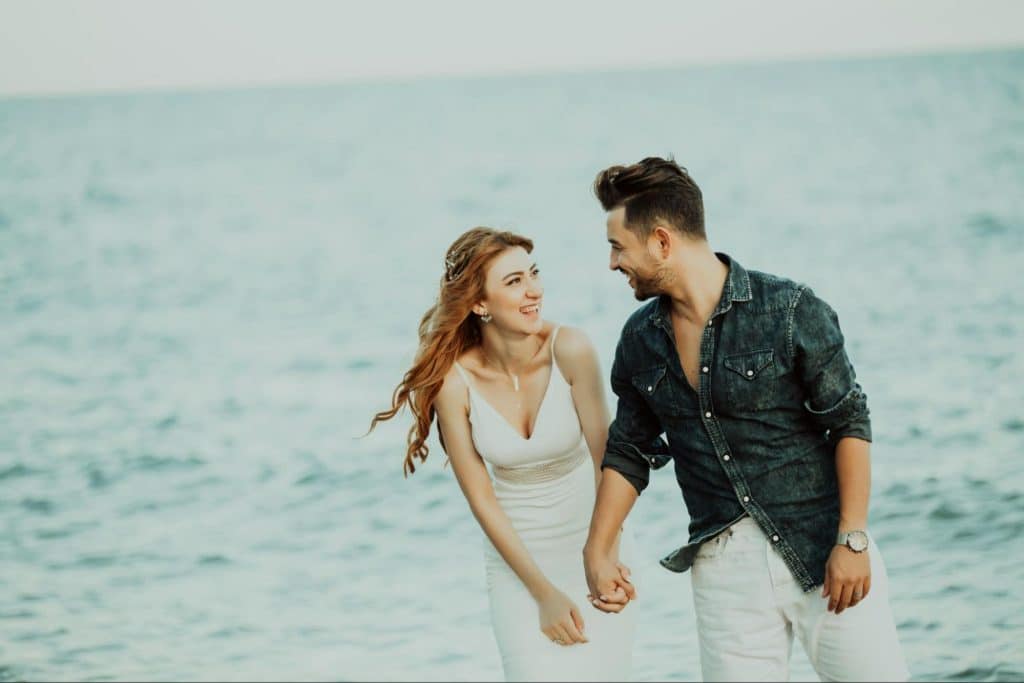 A man and woman holding hands
