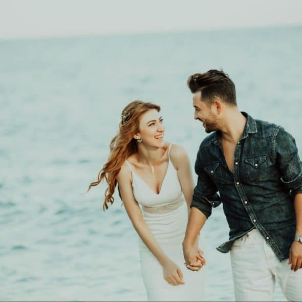 A man and woman holding hands