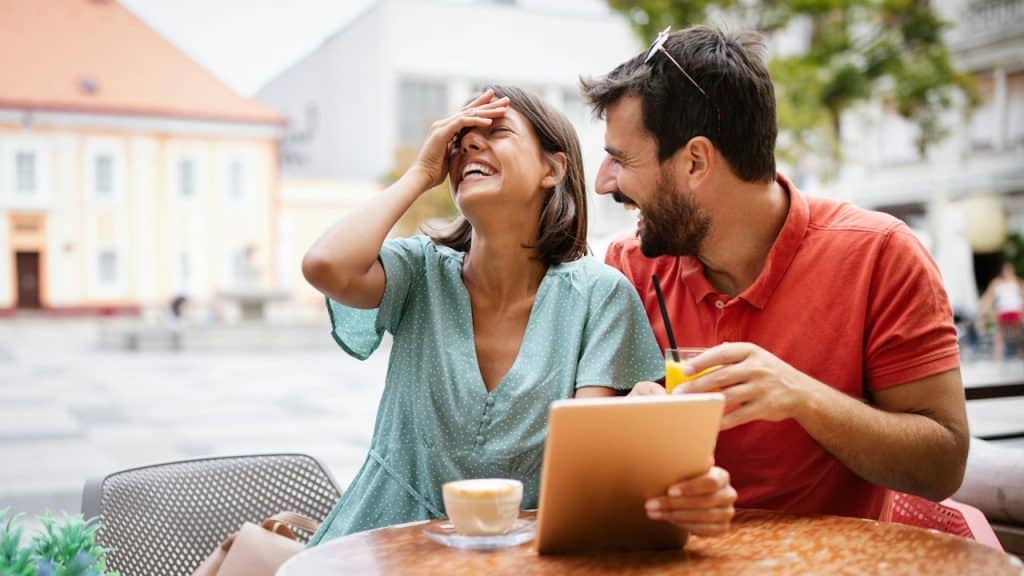 A couple laughing together.