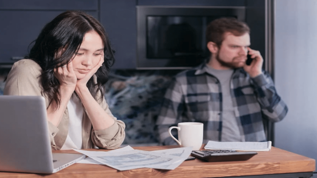 A couple busy with their bills