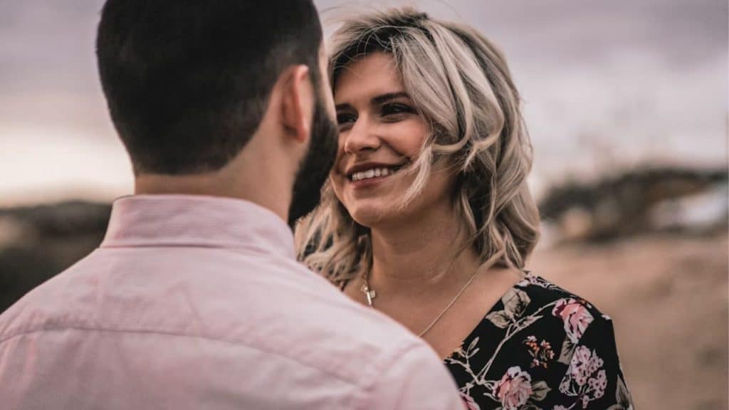 Man smiling while thanking his partner
