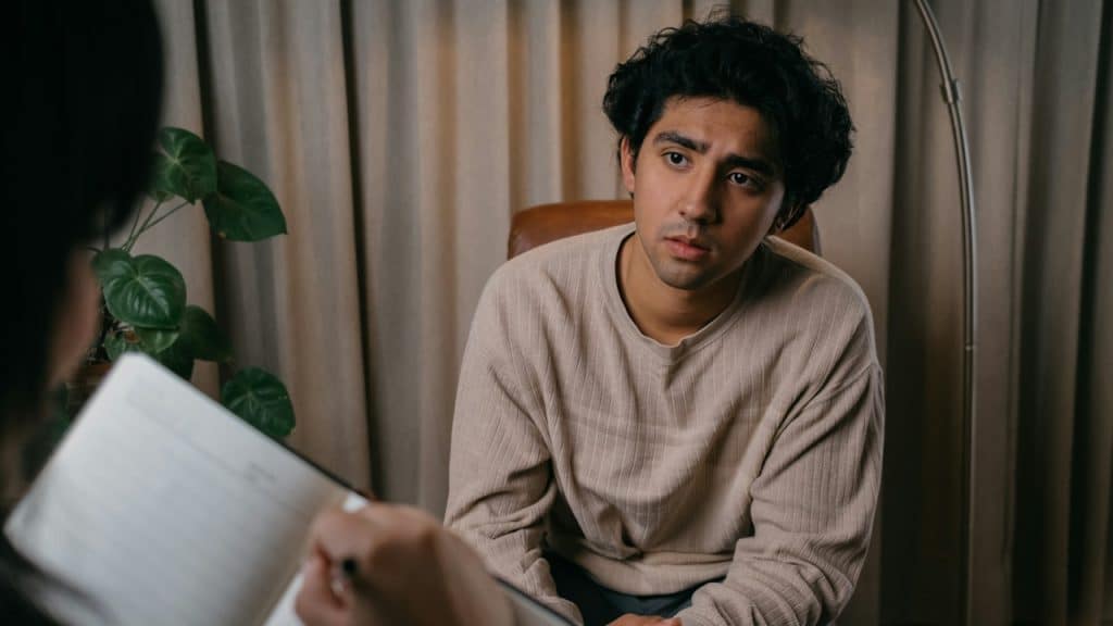 A man seeing a therapist.