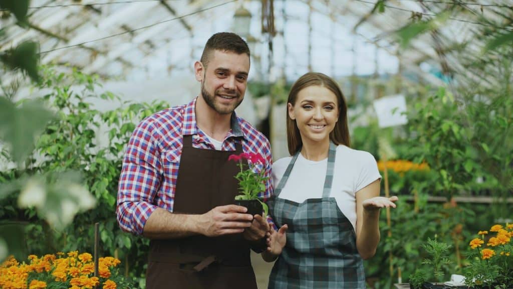 A couple in a greenhouse