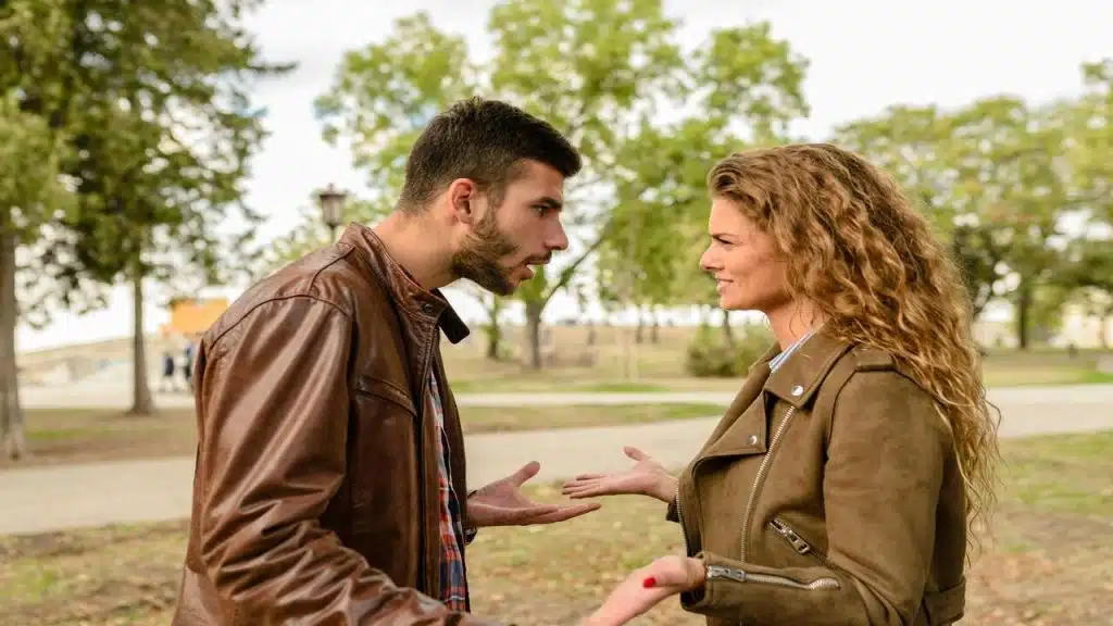 A couple fighting in the park