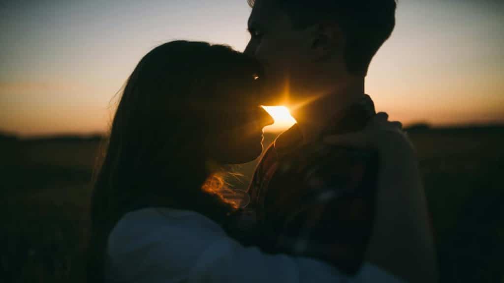 A couple hugging at dusk