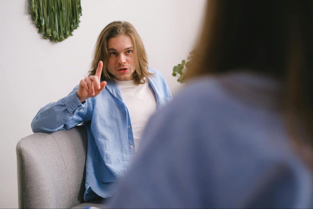A man talking to woman