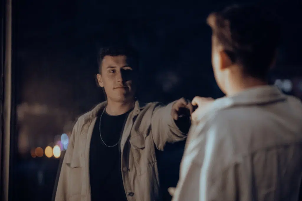 A Man Looking at his Reflection