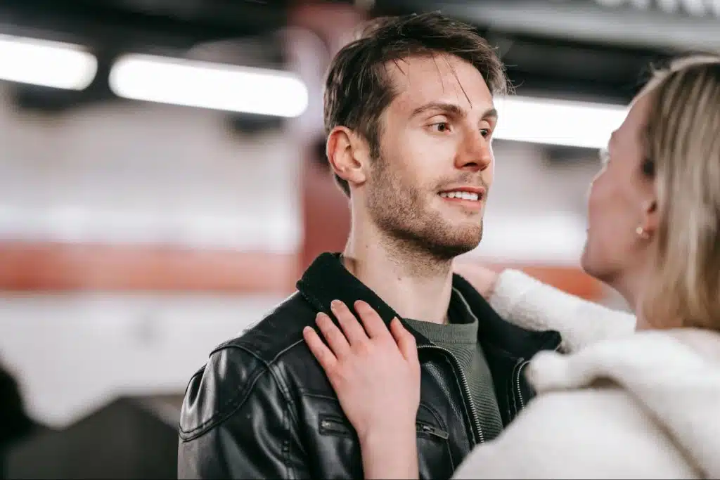 A man looking at the woman