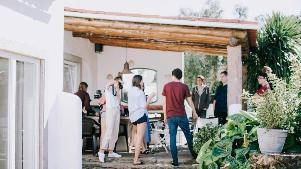 A group of people socializing on a patio.