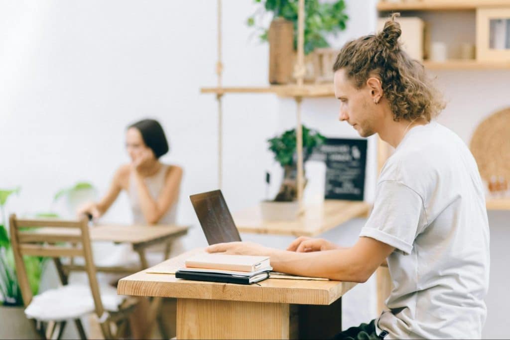 A man and woman busy with their work