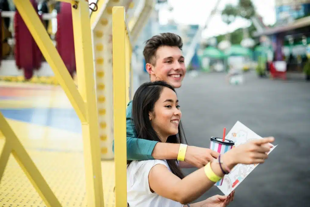 The couple is in the amusement park.