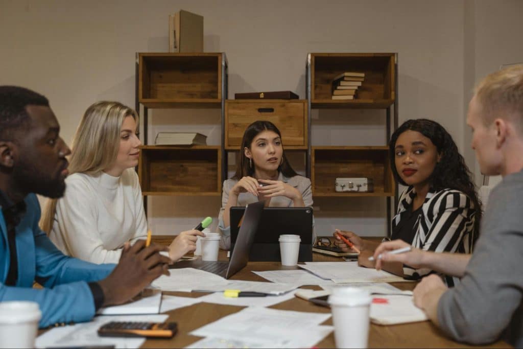 A group of people having conversations 