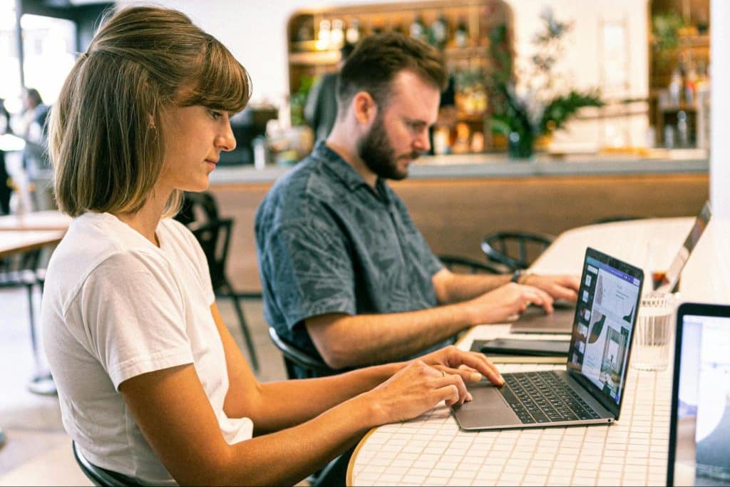 A man and woman busy working