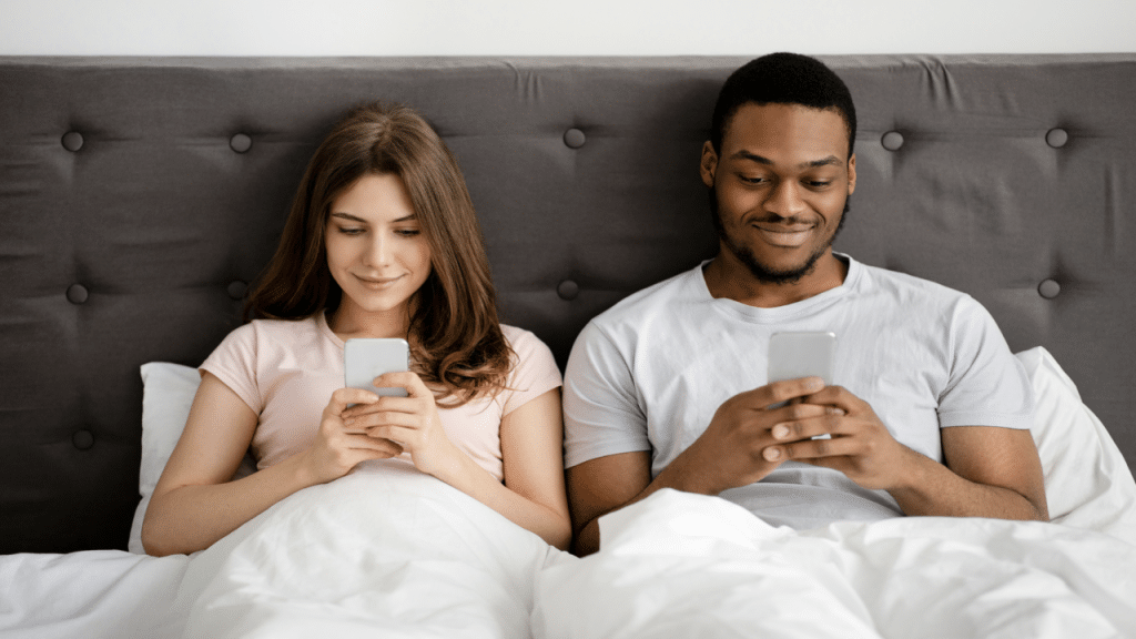 A couple busy with their phones