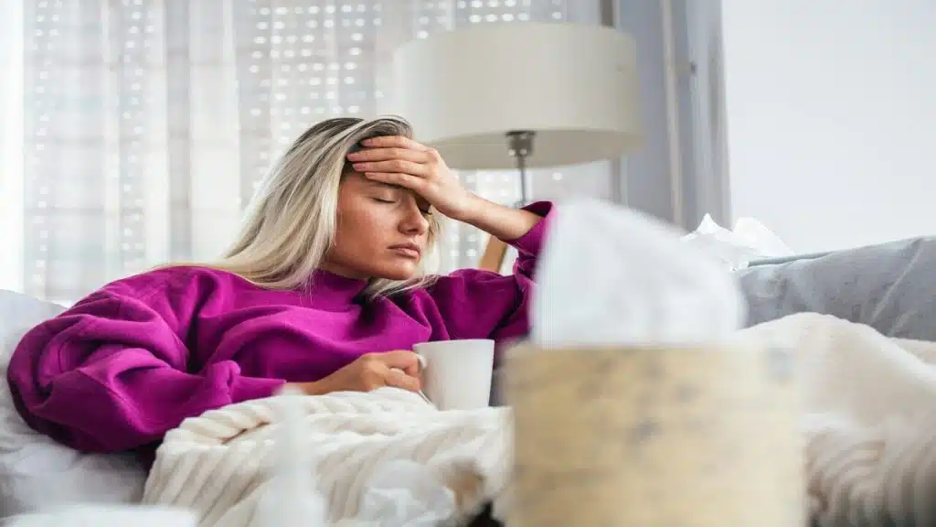 A woman sick in bed