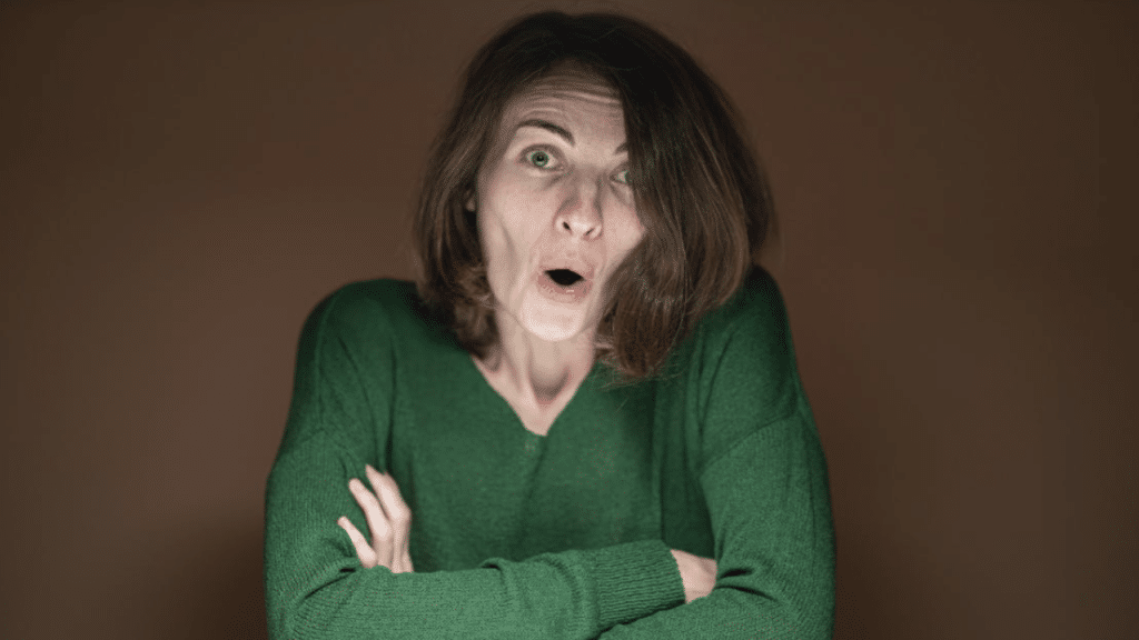 A woman making a sarcastic face