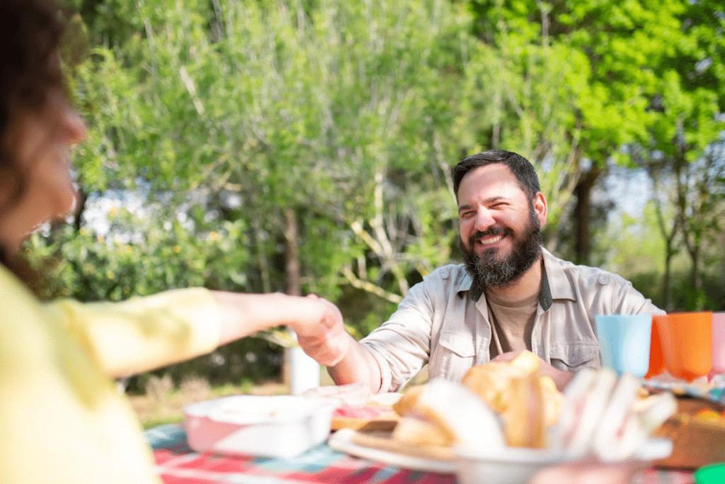 Bearded Man Holding the Hand of a Woman