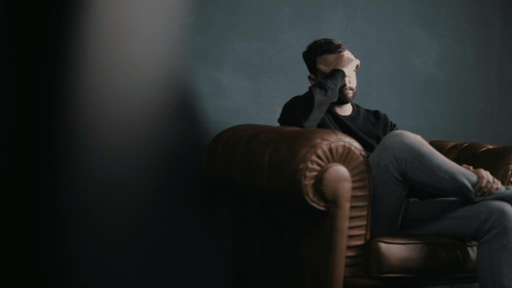 A man looking upset indoors