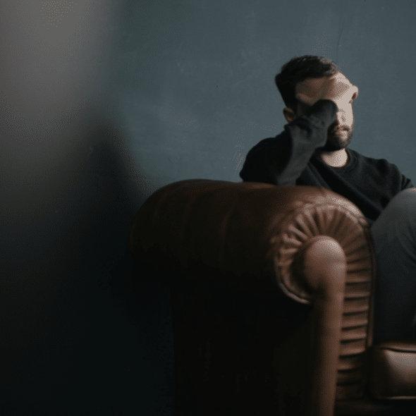 A man looking upset indoors