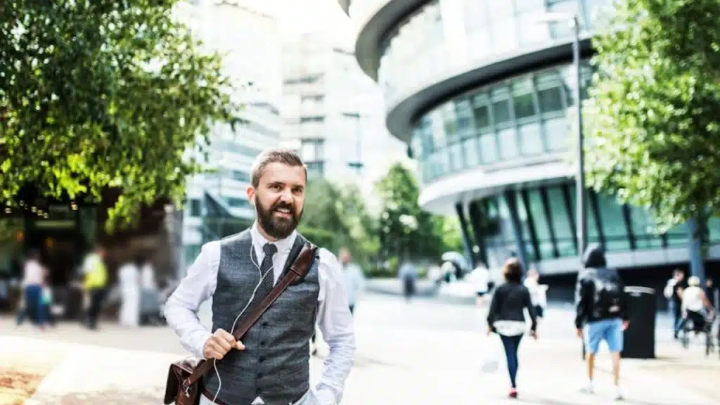 Man walking confidently out of a café after a great date