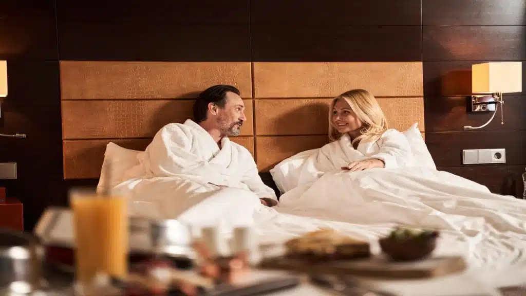 A couple talking in the bedroom
