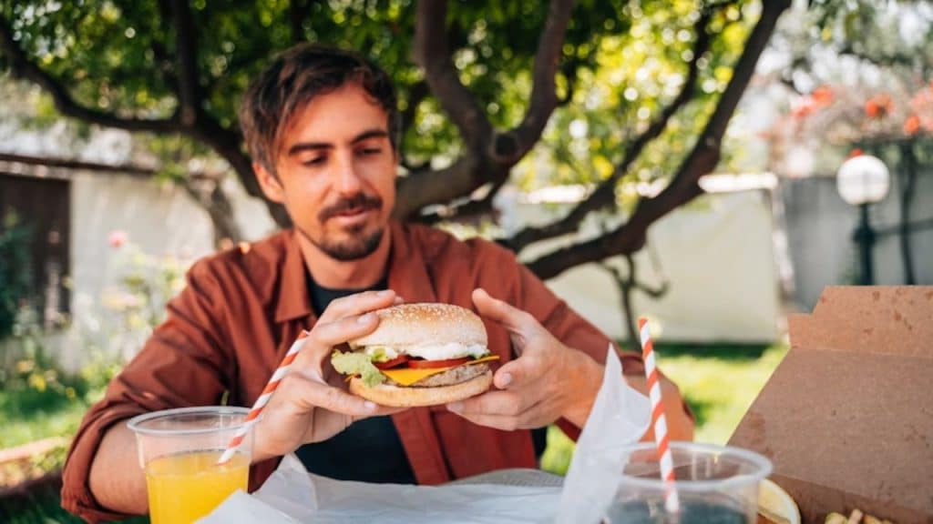 Man eating fast food