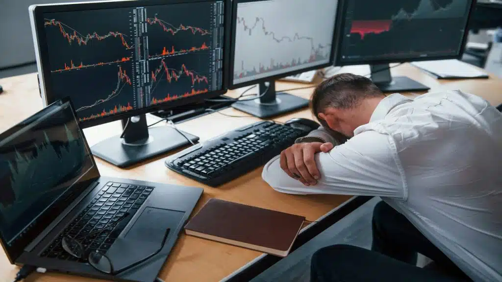 A man looking stressed at work