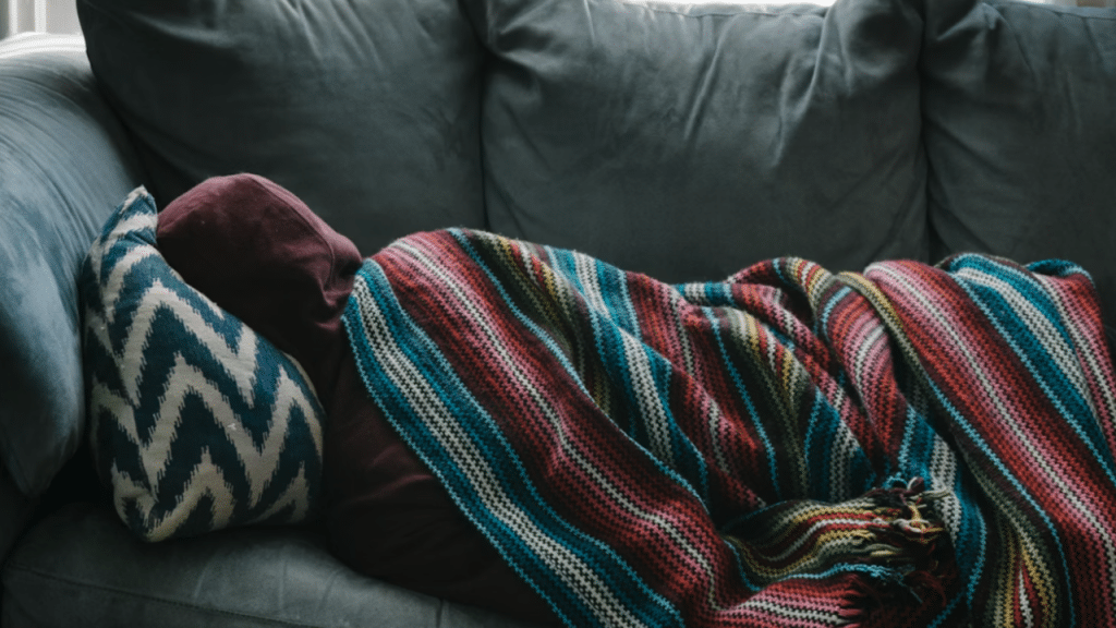 A man sleeping on the couch