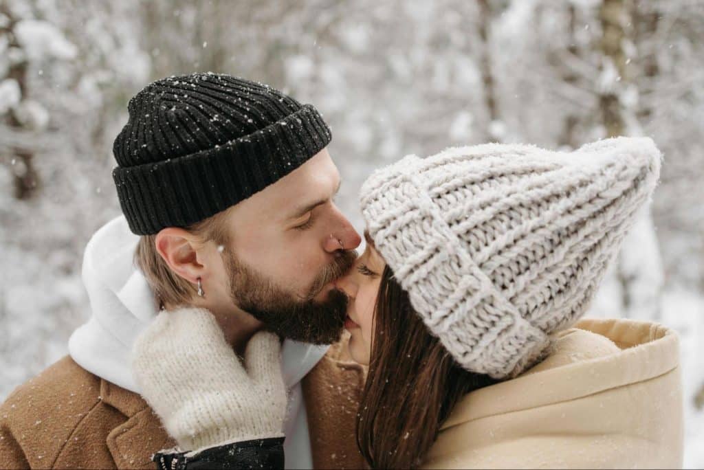 A man kissing a woman’s nose