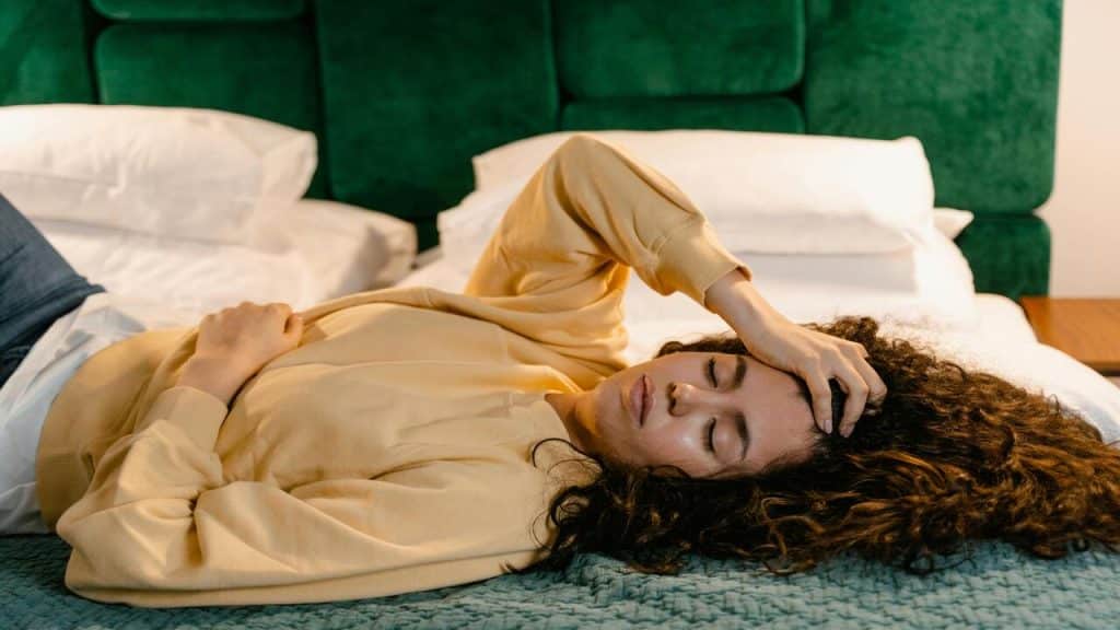 A woman looking tired at home
