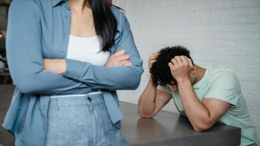 A couple fighting in the kitchen
