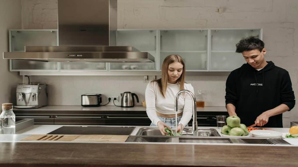 A couple preparing food in the kitchen