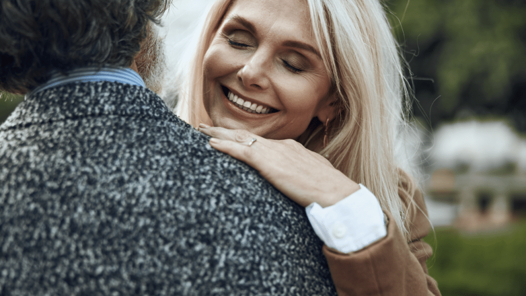 A woman hugging her husband