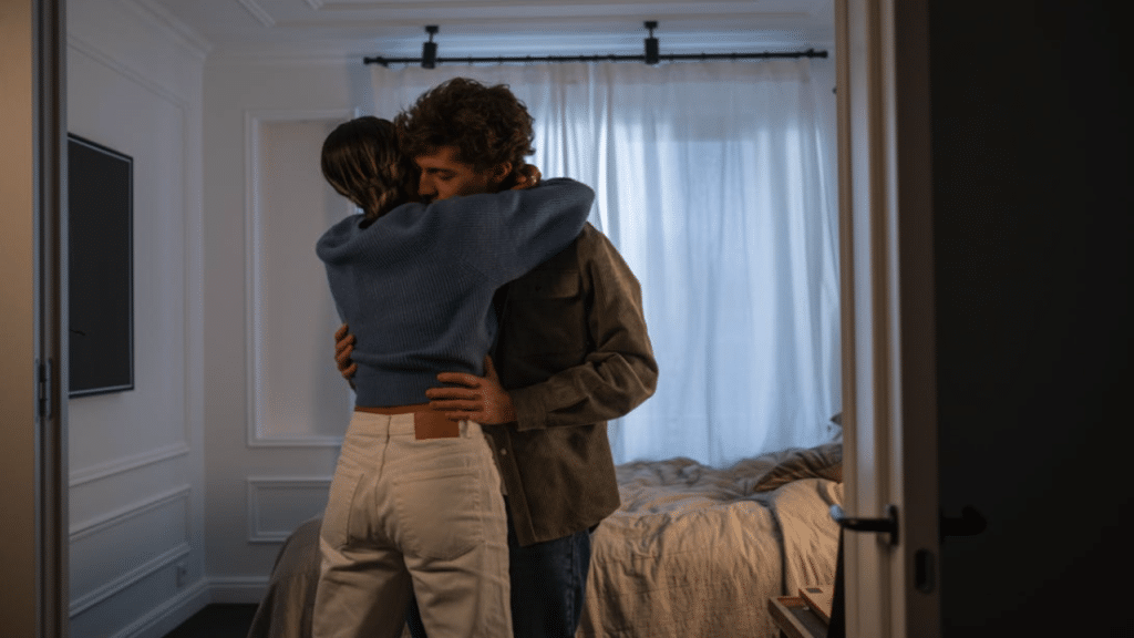 A couple hugging in the bedroom