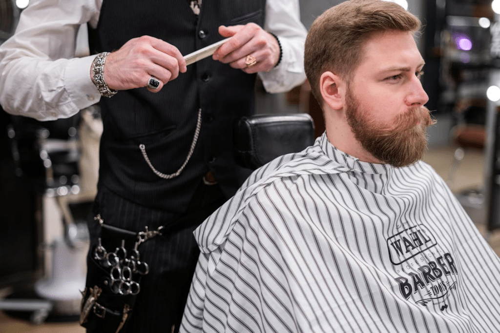 Photo of a Barber Giving a Haircut