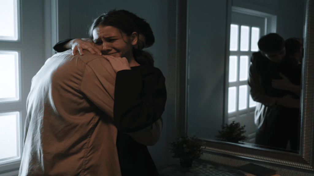 A man comforting his crying girlfriend
