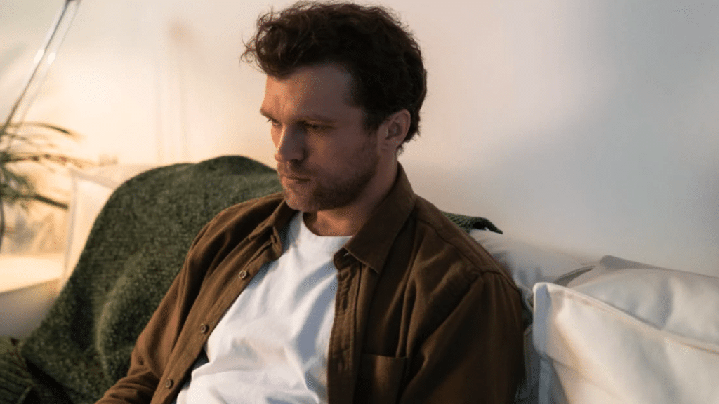 A man looking sad on the sofa