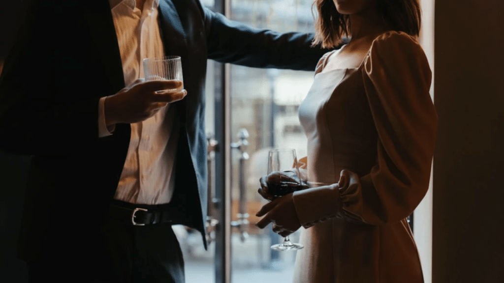 A man flirting with a woman at a party