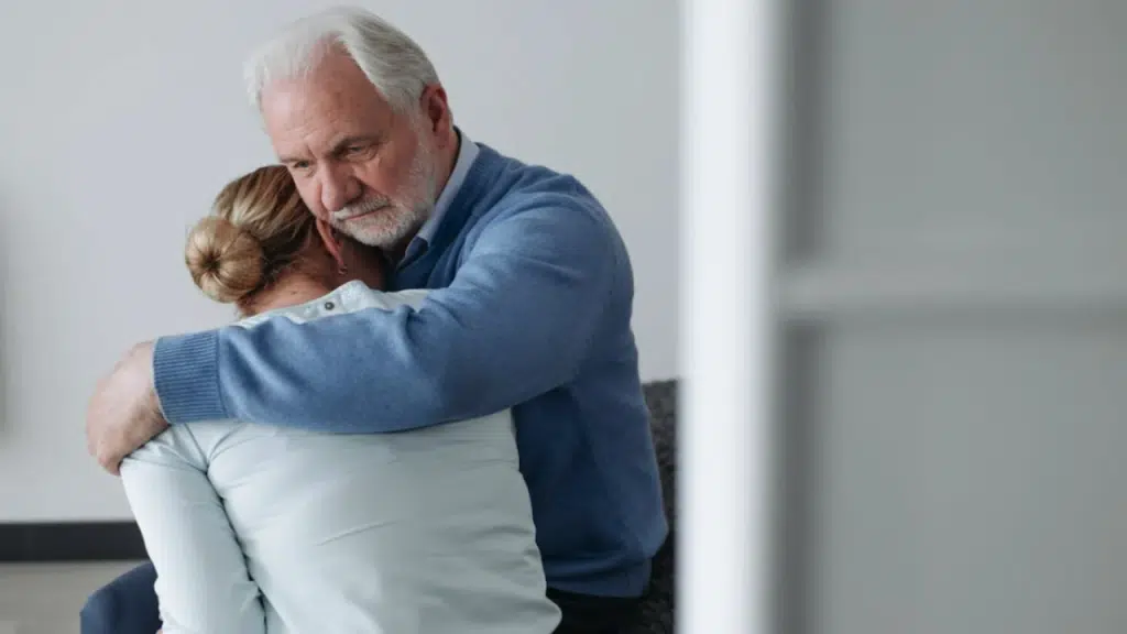 A man comforting his upset wife
