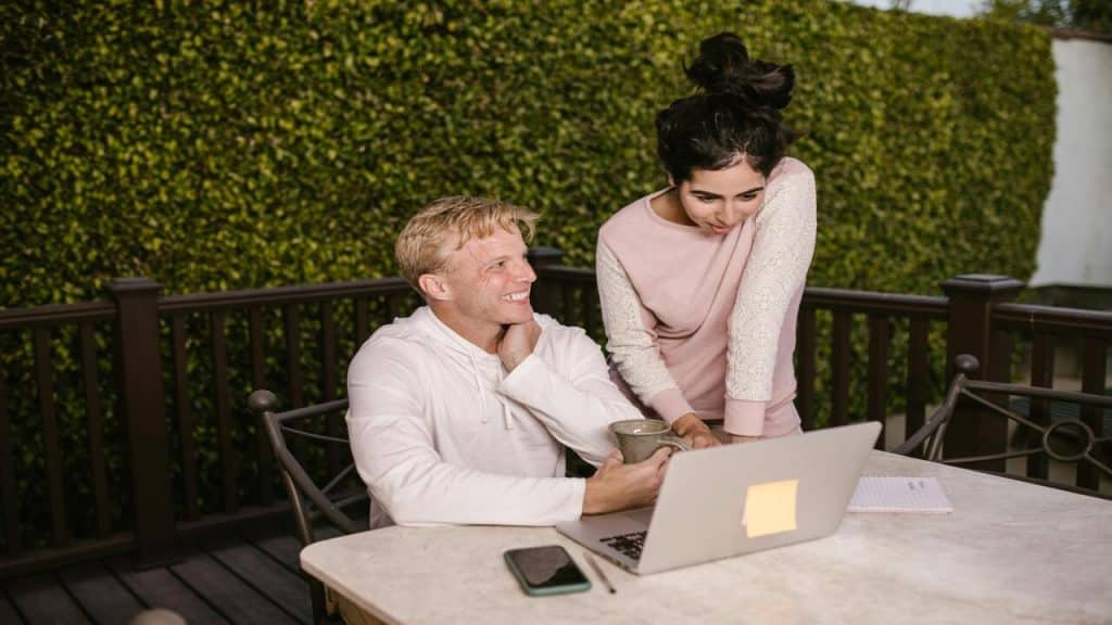 A couple looking at something on a laptop