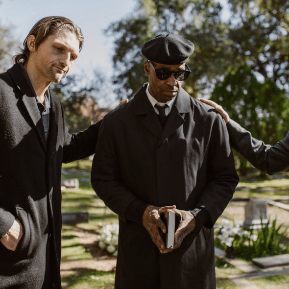 Photo of Man Being Comforted